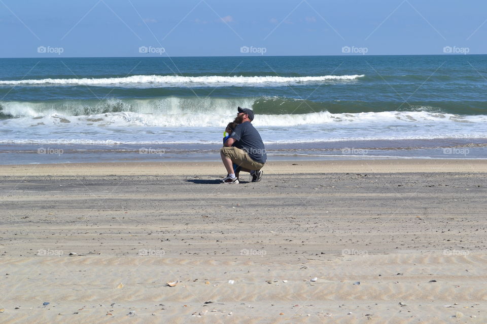 man with son beach