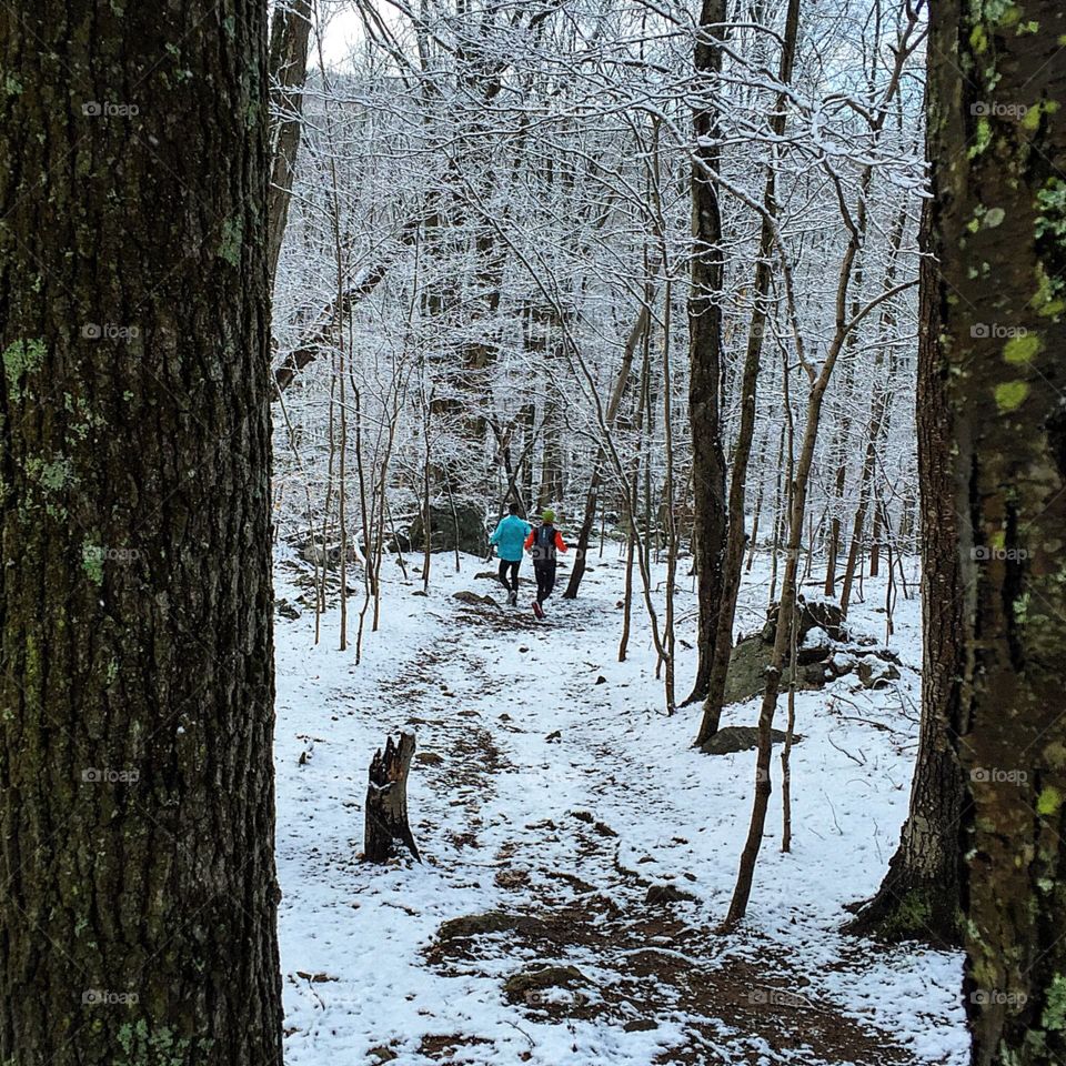 A runner runs through it. 