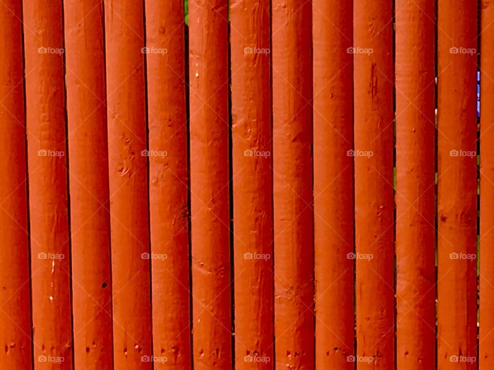 Close-up of orange wooden fence
