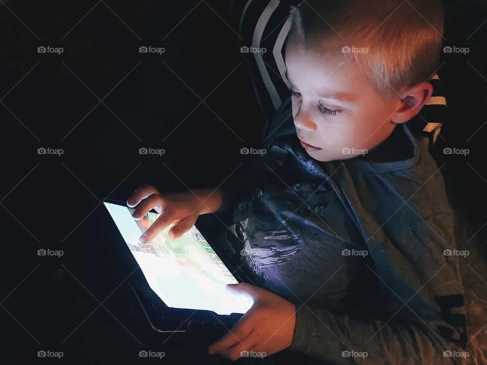 Boy using the tablet