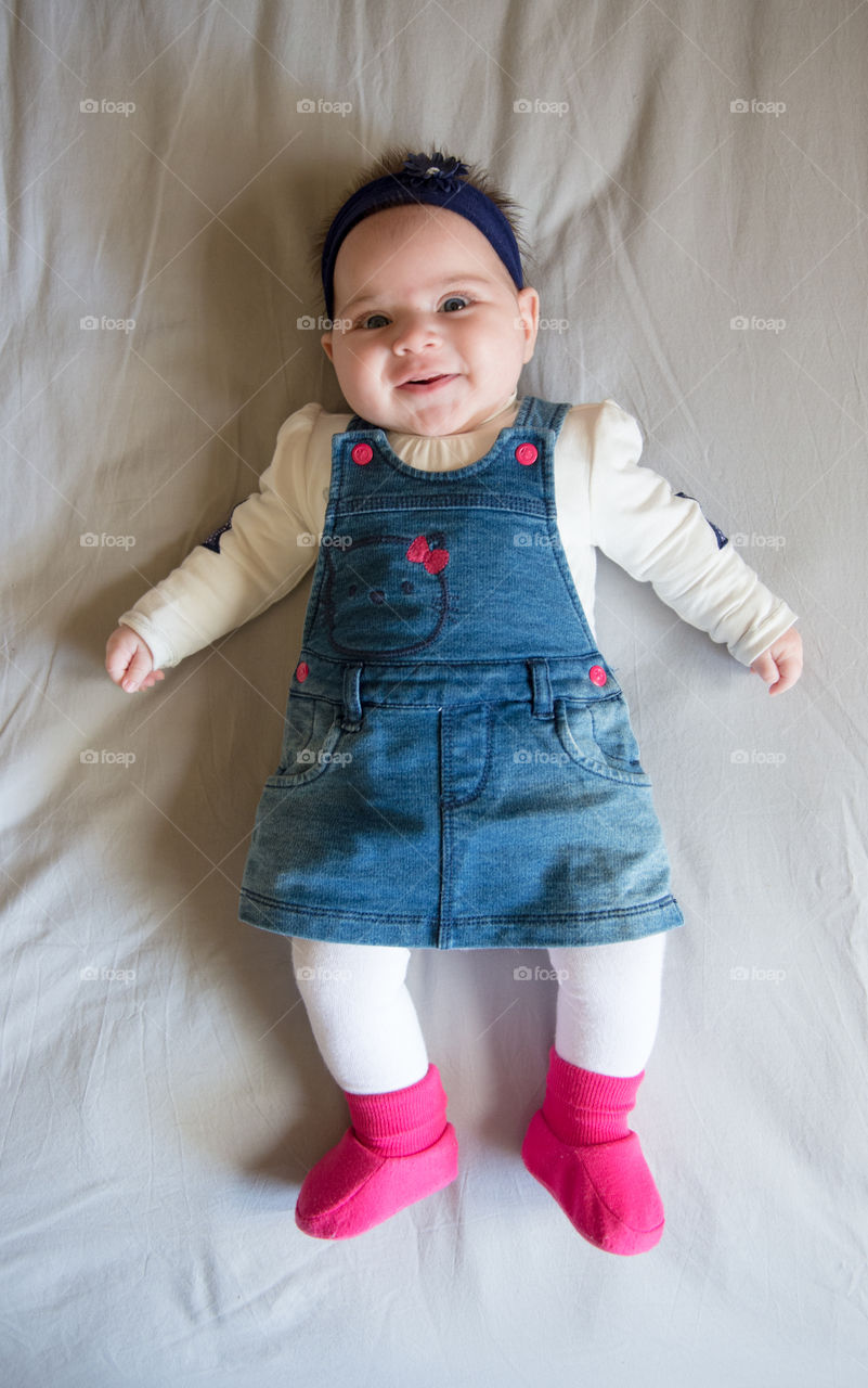 Cute baby girl on bed