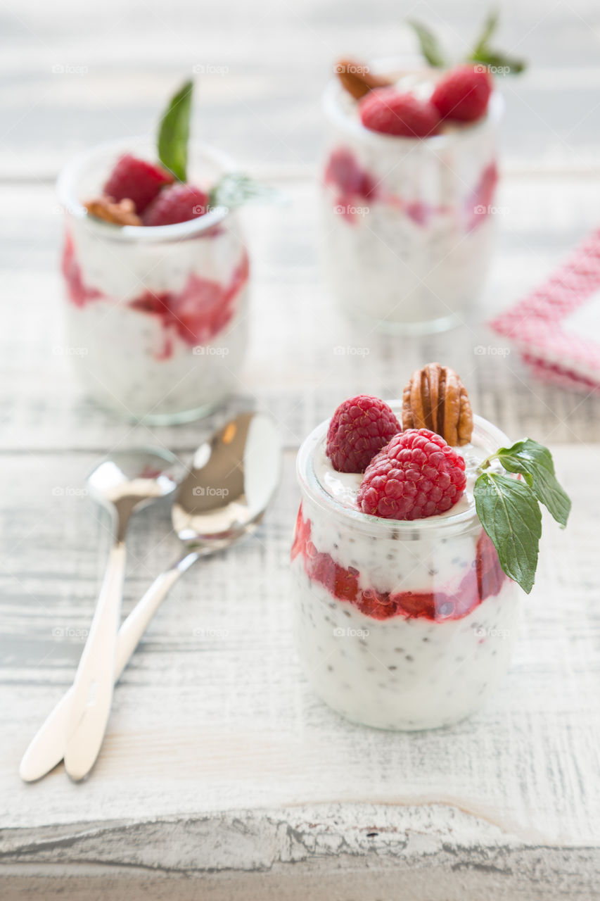 Yogurt with raspberry and mint leaf