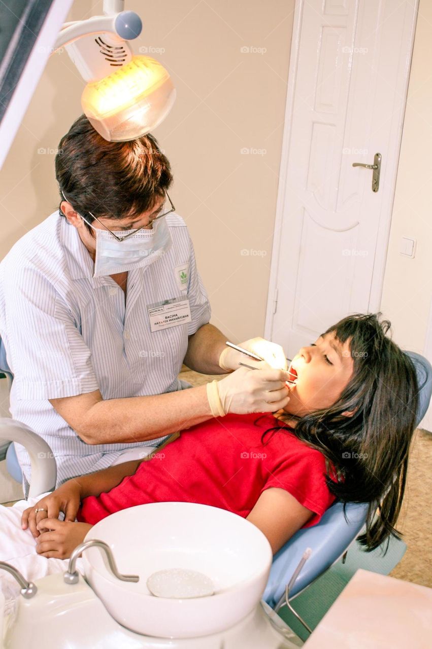 Child treated by a female dentist