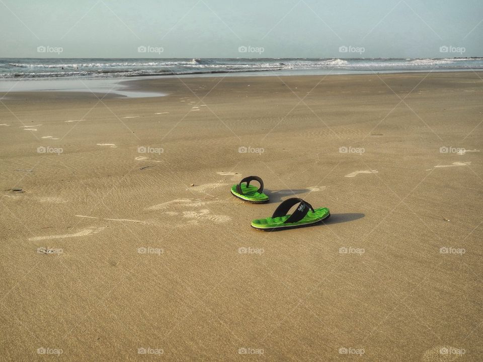 Went swimming. . It's so nice to swim in the ocean in January. This picture of my flip flops was taken in Vietnam. Place called Vung Tau 