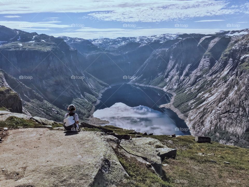 Girl Hiking over the lake 