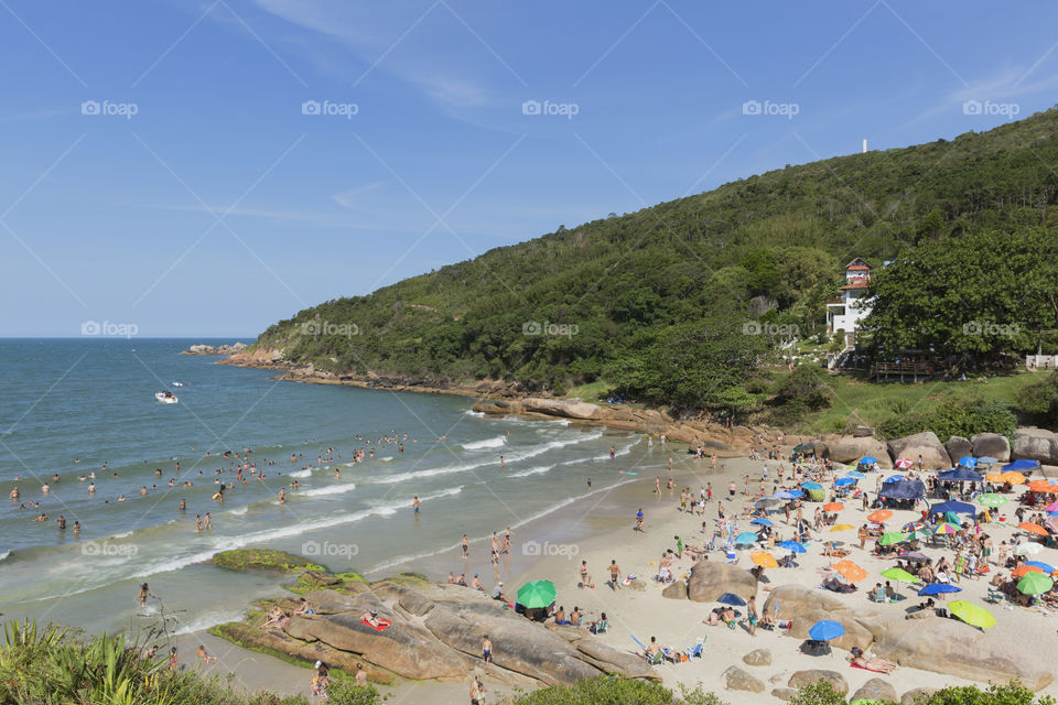 Tourists enjoy the summer on the little beach in Barra da Lagoa in Florianopolis Santa Catarina Brazil.