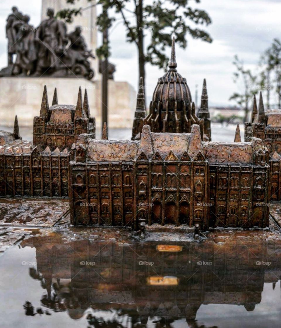 Hungarian Parliamentary building statue, and it's reflection  