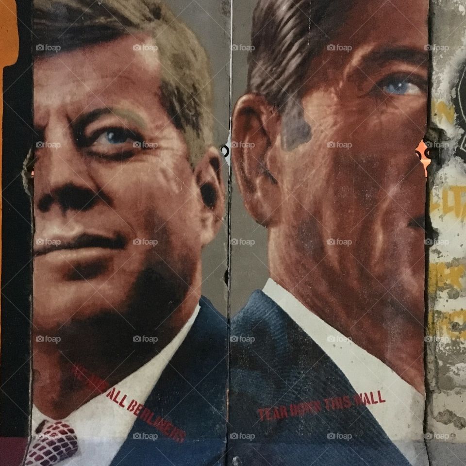 President Kennedy and President Reagan on a piece of the Berlin Wall