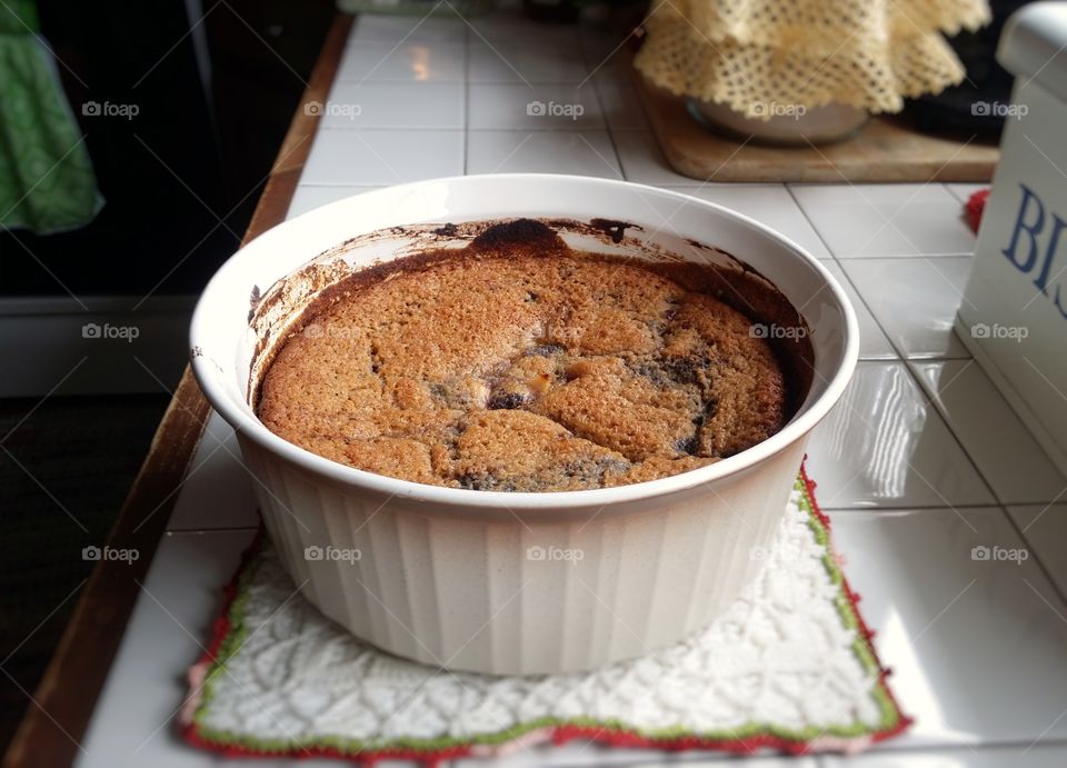 old fashioned blueberry pear cobbler sitting on a kitchen counter ready to eat dessert homemade