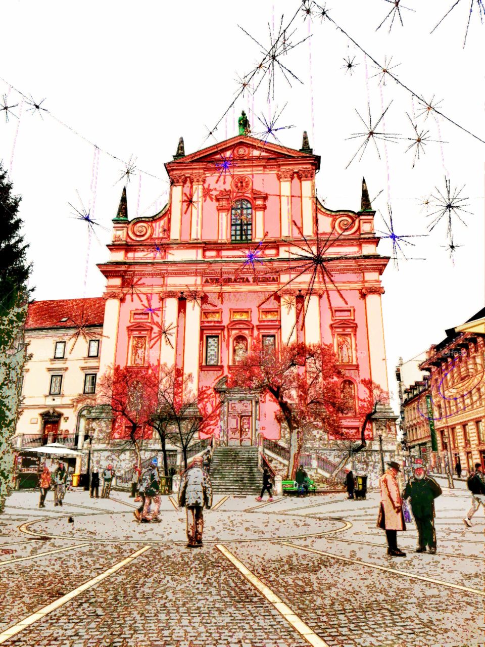 Red Franciscan Church of Annunciation in historic Oldtown Ljubljana, Slovenia, at Preseren Square in Winter