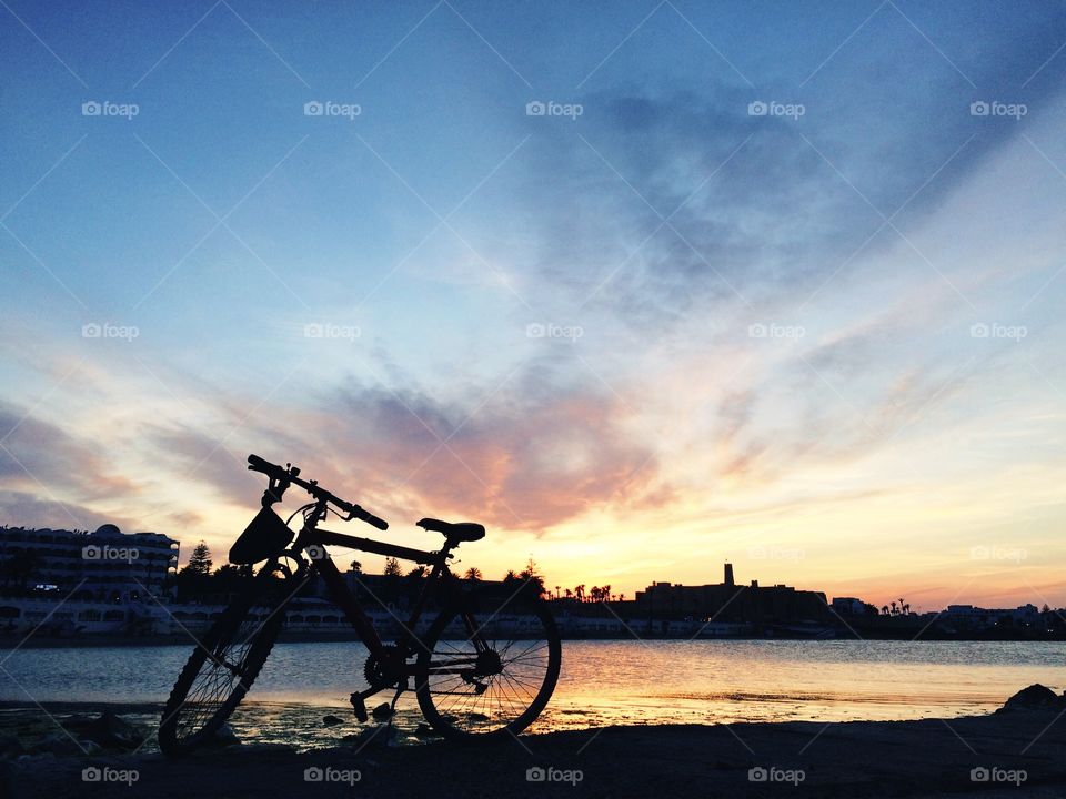 bycicle in front of sunset. bycicle in front of sunset