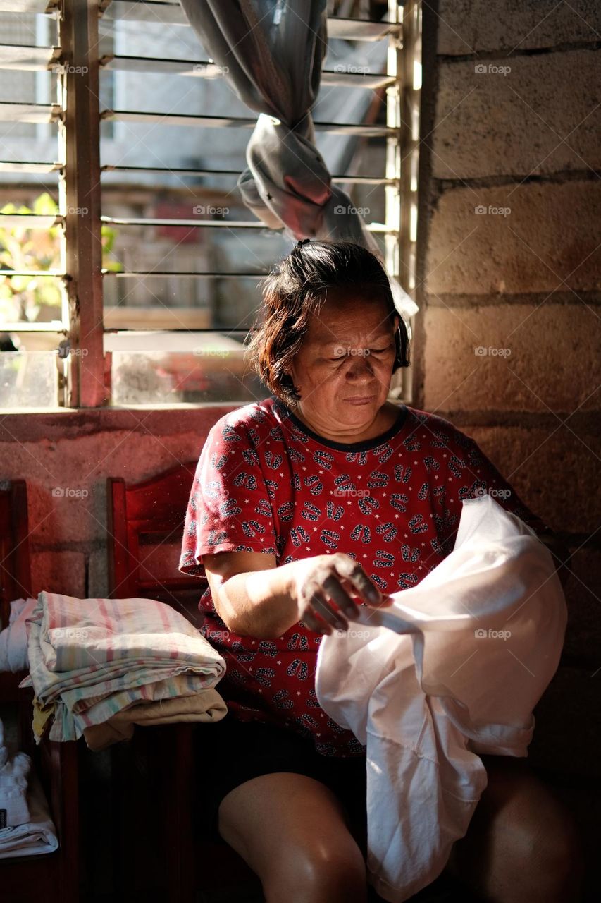 My beautiful mom doing the laundry