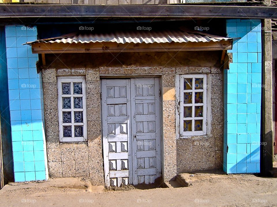 'The house' a resident's house in Antananarivo Madagascar Africa with square shaped windows door and walls. Love the blue contrast!