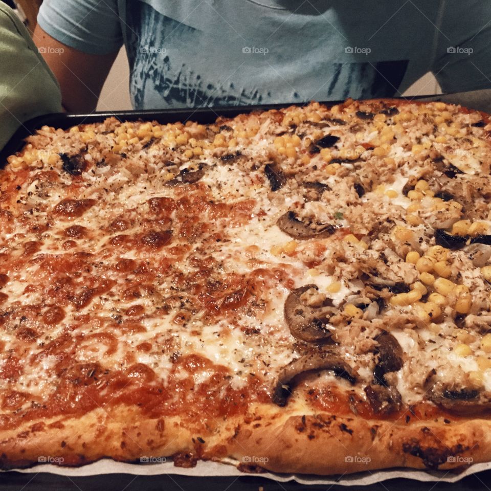 Fresh prepared homemade pizza served to the family