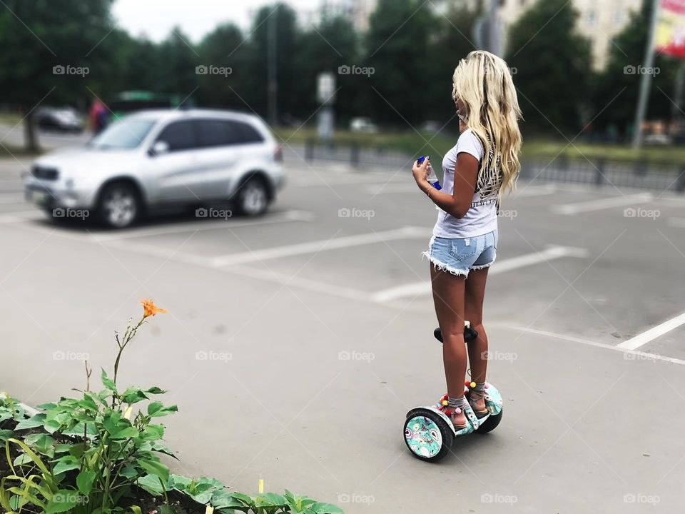 Riding a scooter in the city 