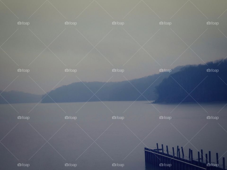 A misty morning at the boat dock by the lake