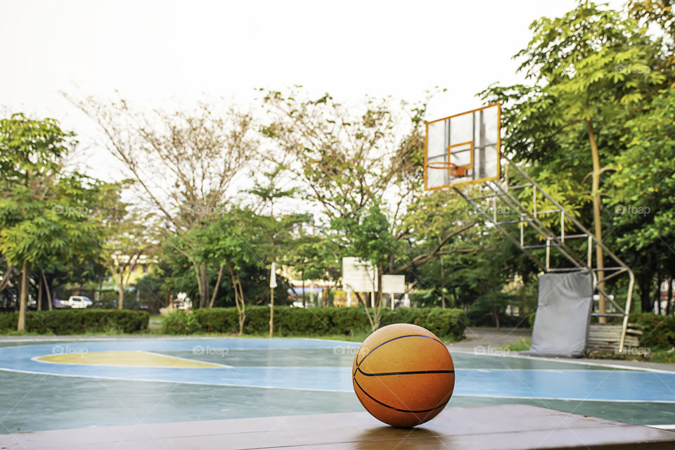 Basketball on the wooden chair Background basketball court and park.