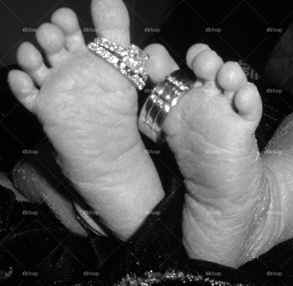 My baby's feet with our wedding rings