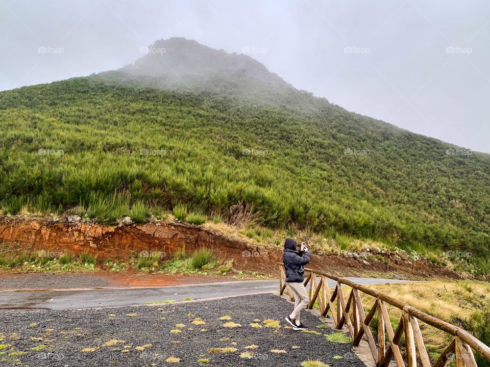 Taking photos of beautiful mountain landscape 