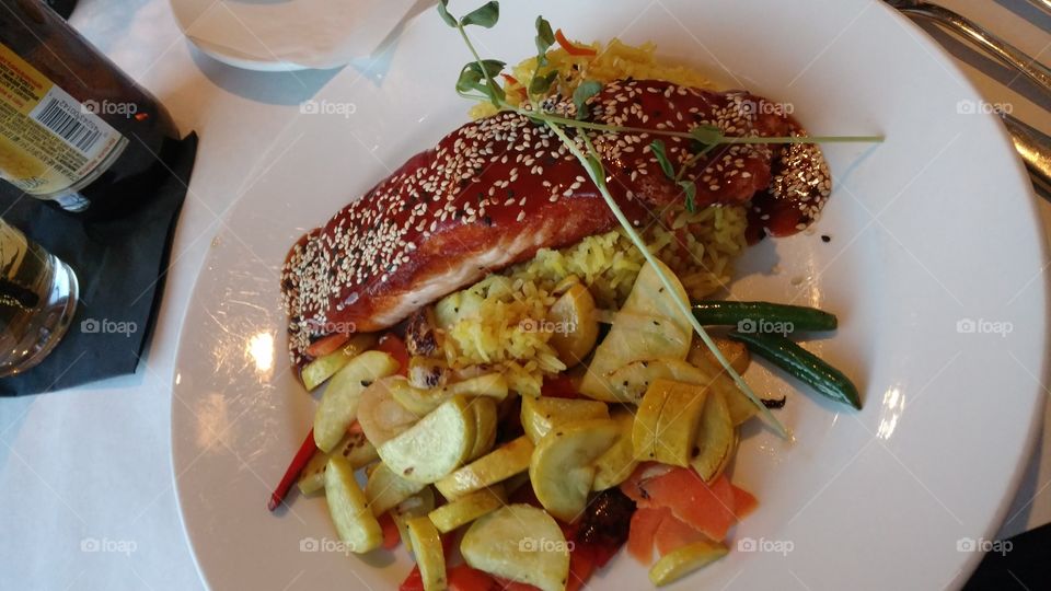 Asian barbecue salmon over roasted vegetables and rice