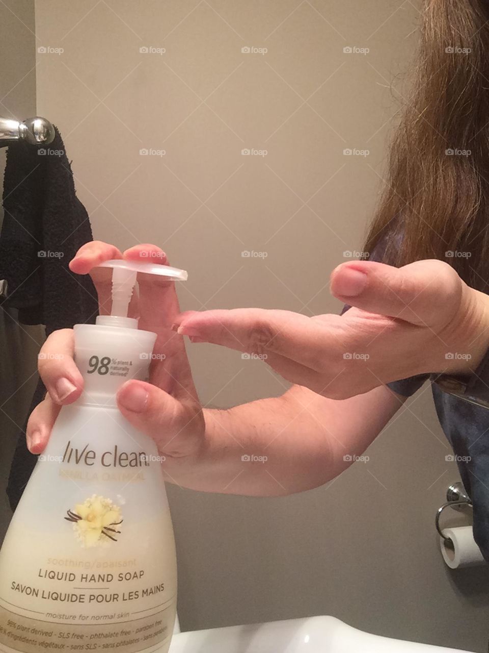 Using Live Clean Hand Soap on my hands