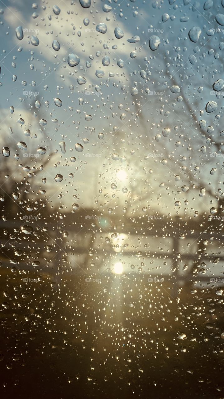 I didn’t roll my window down after a driving Rainstorm when i noticed the Sun shining Bright. Put the Camera up to the glass and here is the Pic.