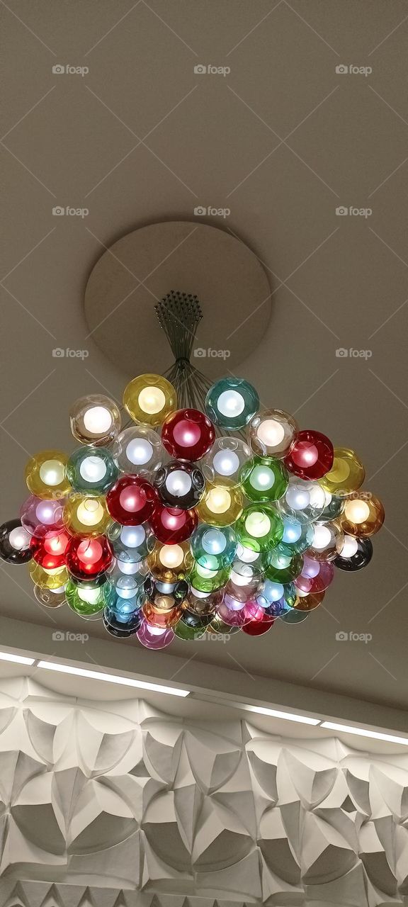 energy of color and light, colorful balls, bright lights, lamp, chandelier, lights under the ceiling, colored glass