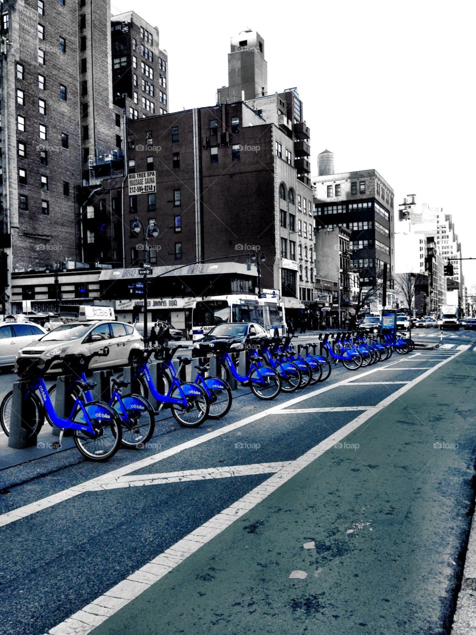 Citibikes, New York City . Citibike a, New York City. Black and White with blue colorsplash
