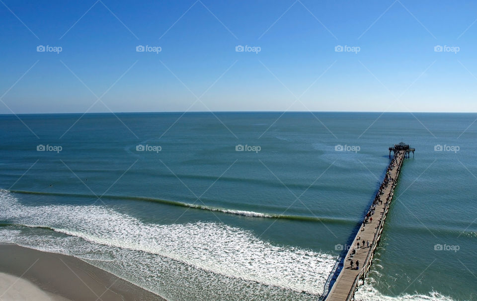 You can see forever! View of Atlantic Ocean and the famous Cherry Grove Fishing Pier in South Carolina. 