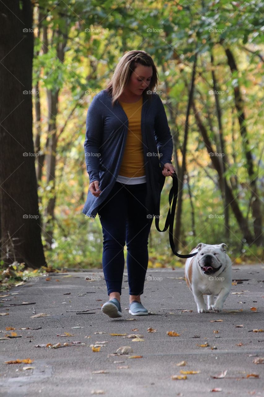 Woman walking her bulldog