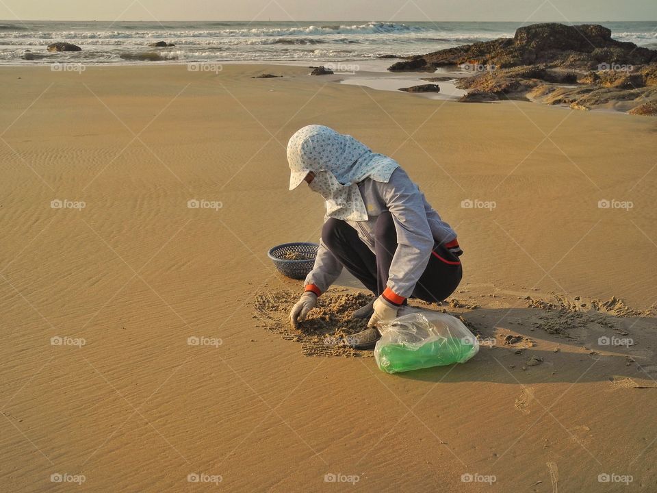 Digging through sand.