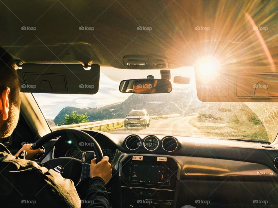 Driving a car to the sunrise high in the mountains of Crimea.