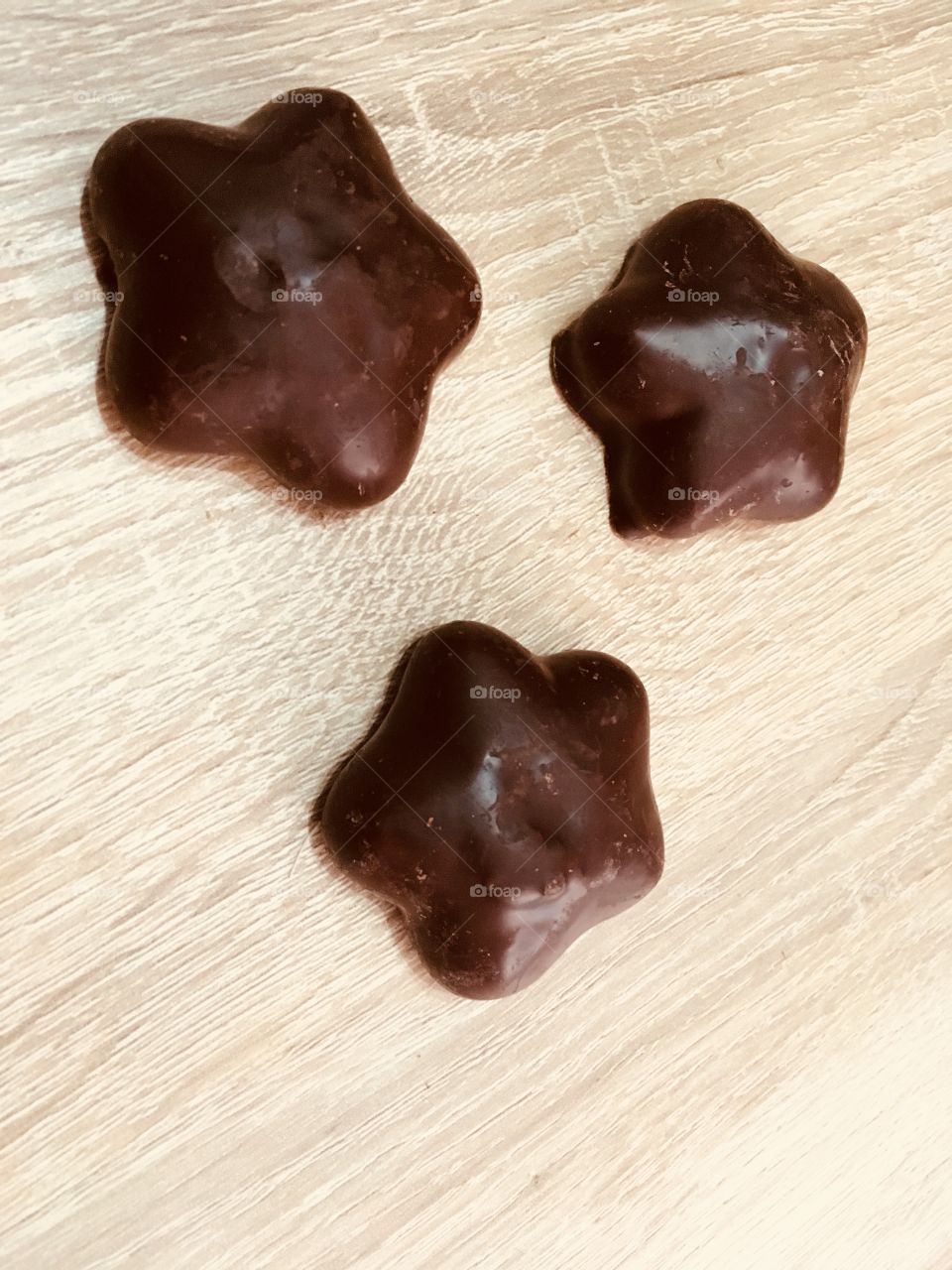 Chocolate stars on wooden table