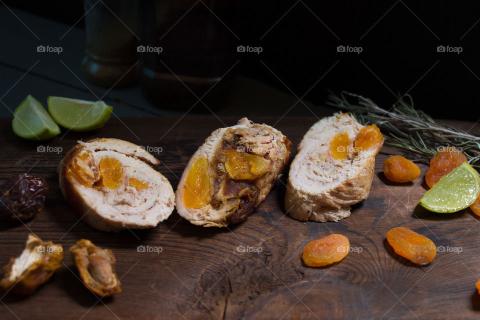 Chicken Ballotine stuffed with dates and dried apricots.