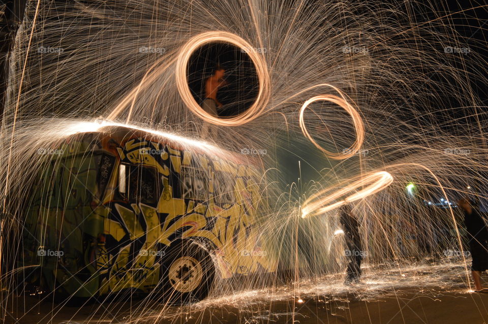 spinning fire. late night for spinning in a graffiti address of town