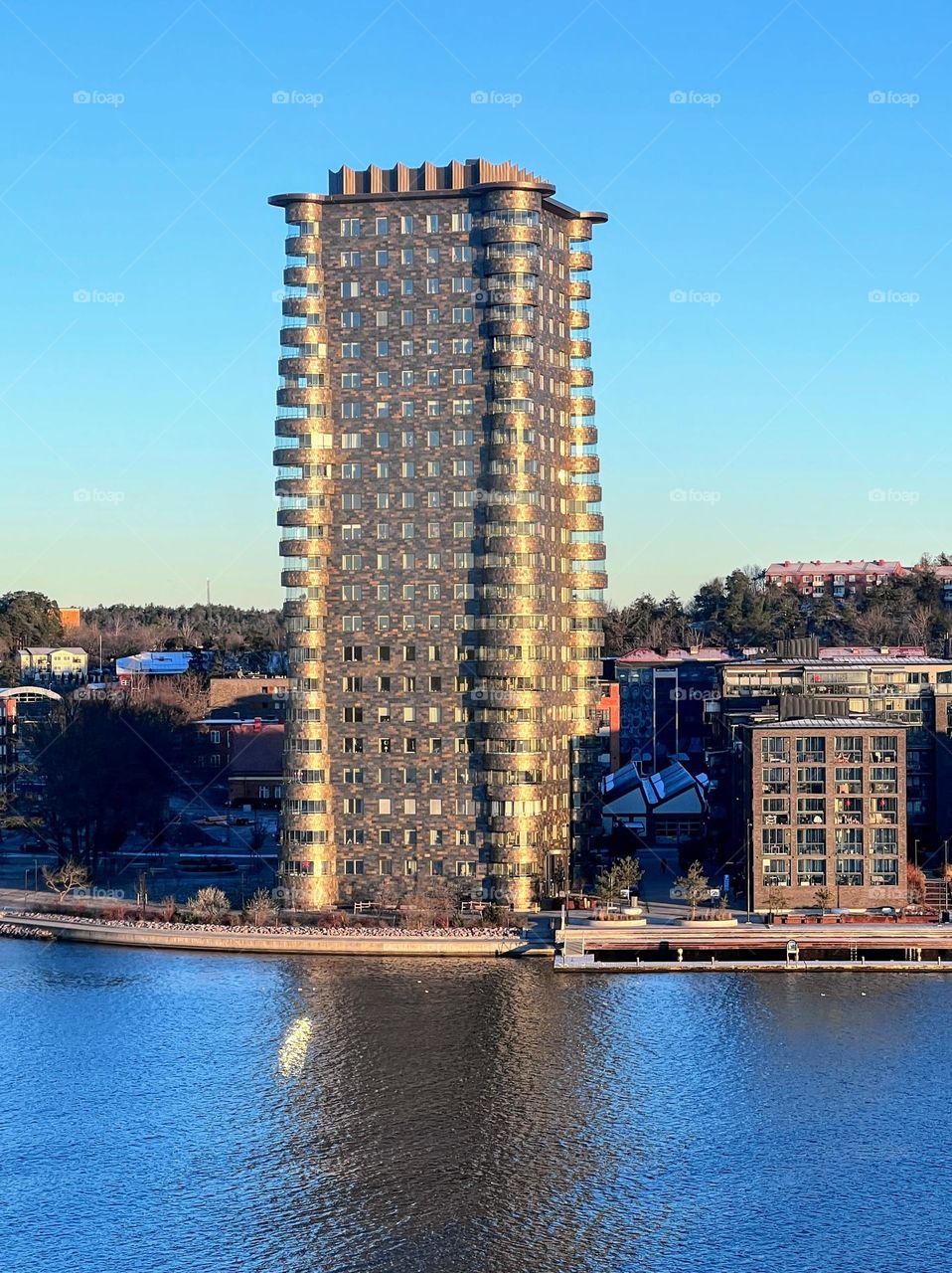 Tall futuristic residential house skyscraper on the shore of the Gulf of Finland 