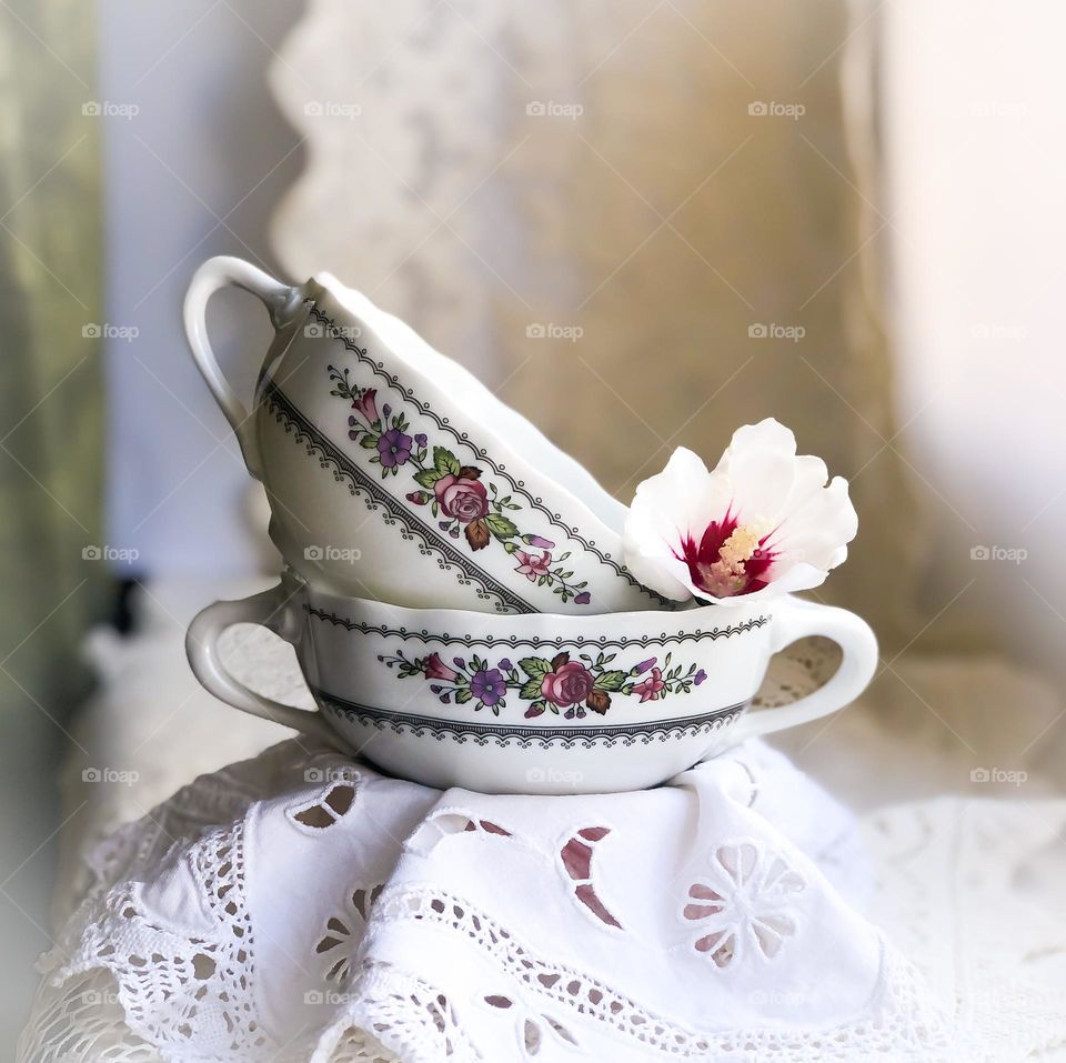 Antique porcelain bouillon cups with floral pattern