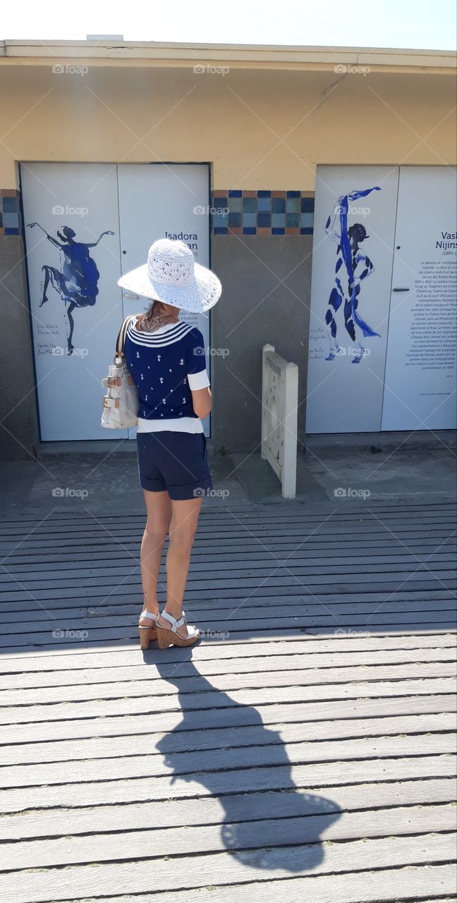 on the sidewalk of Deauville