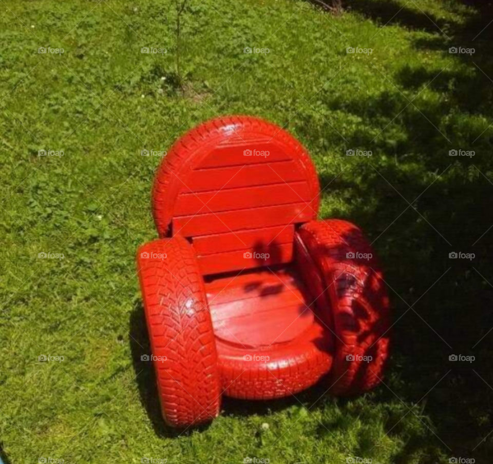red armchair from old tire handwork