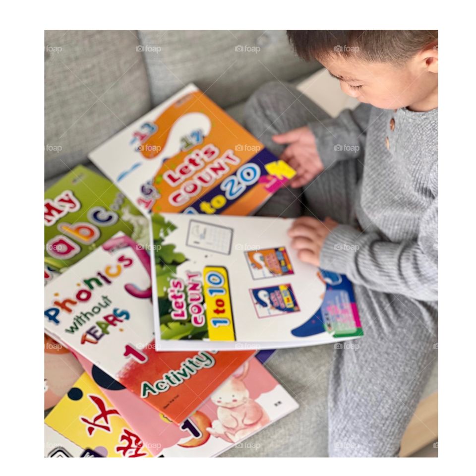 Asian Preschooler with books 