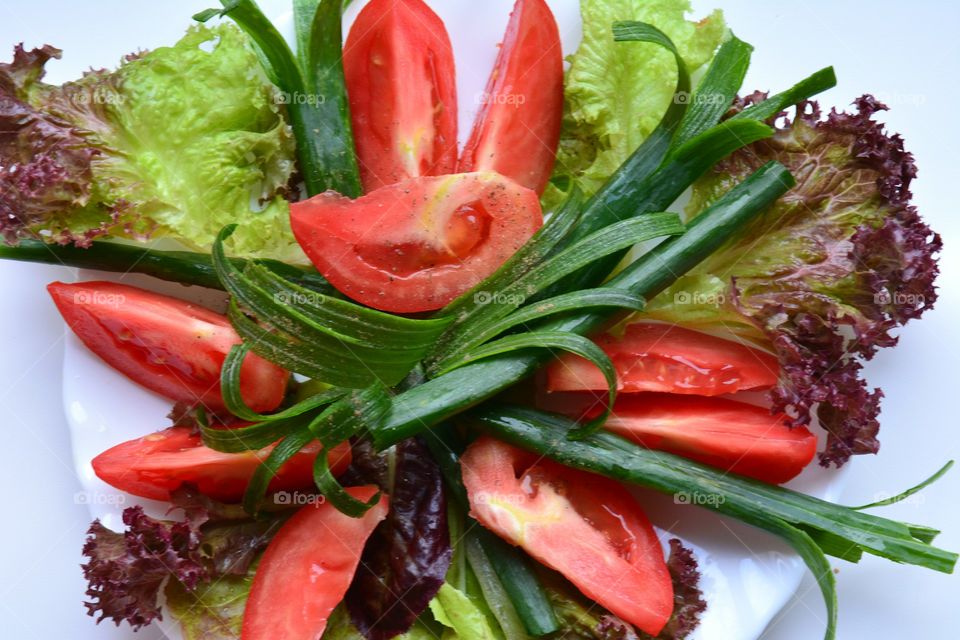 Variety of raw food salad on plate