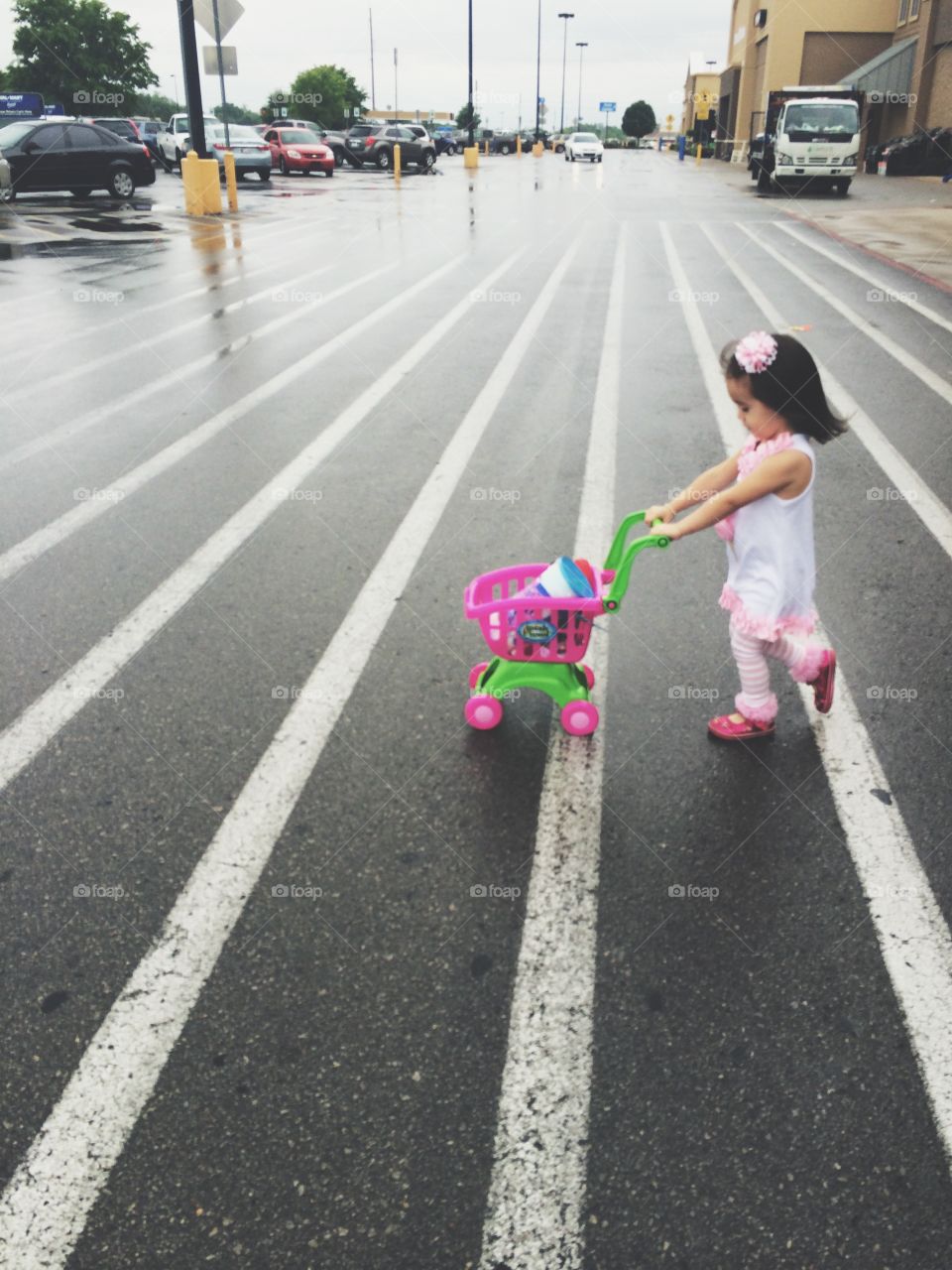 Little girl crossing the road