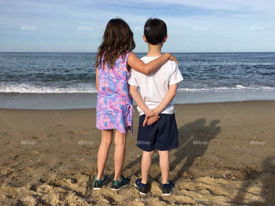 Boy and girl at the beach. 