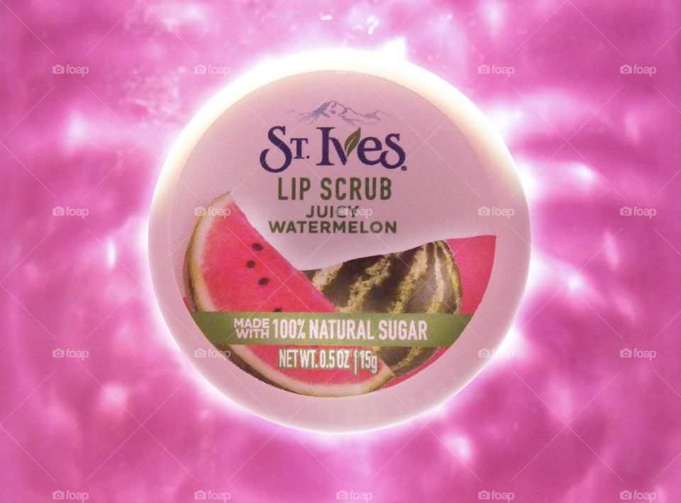 St. Ives lip scrub juicy watermelon flavor made with 100% natural sugar on a bright pink water background