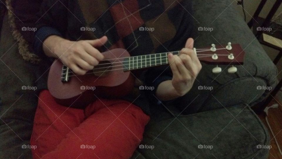 Play the ukulele