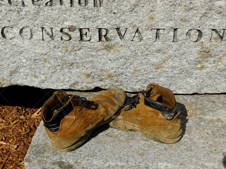 The boots were old. The leather had since cracked and aged. The toes were scuffed and they were falling apart at the seams. The boots had long lived their life of travel,work,joy, and love. After their final journey, it was time to throw them away. It was hard to say GOODBYE!