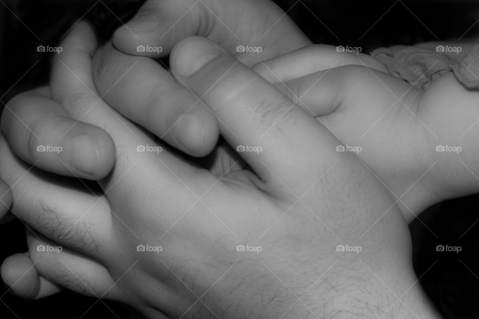 father holding daughter hands