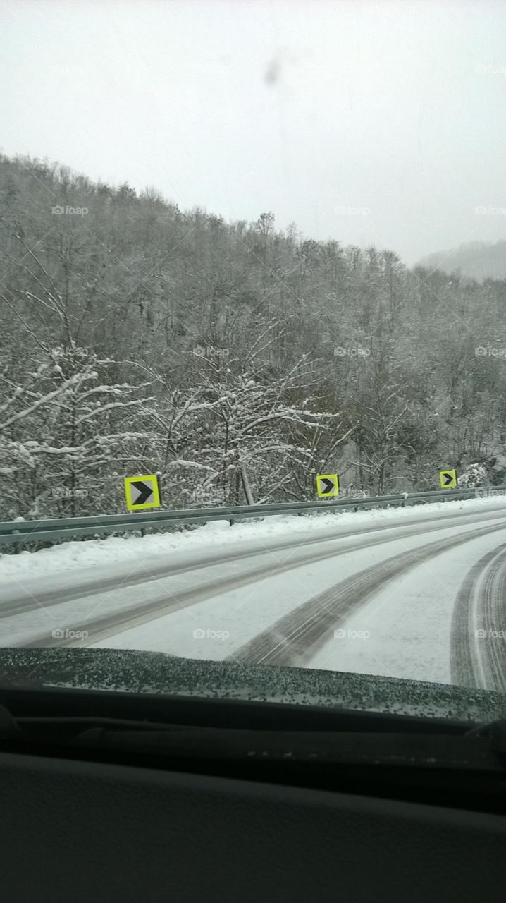 road covered with snow, winter time