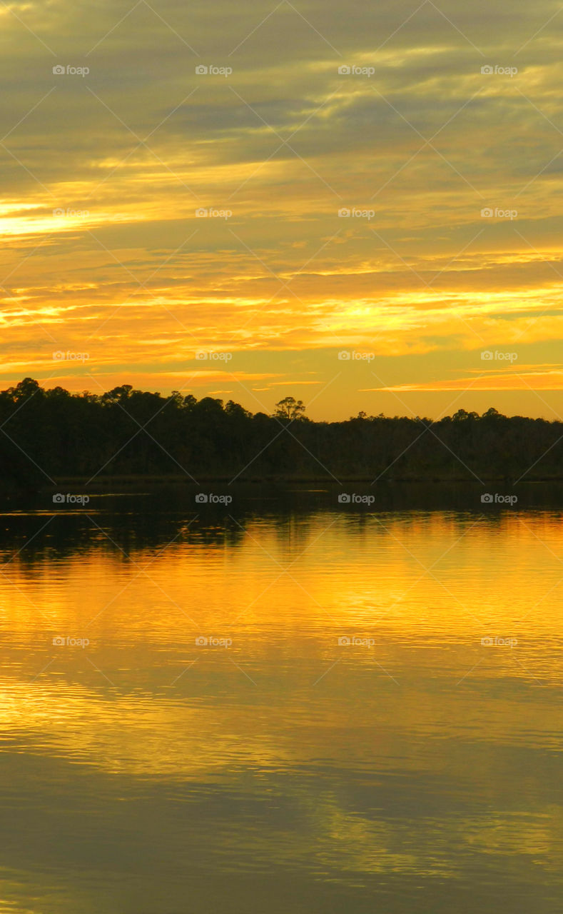 The sky was filled with the most brilliant orange complimented perfectly with hues of gold, yellow, red and crimson. An orange haze had casted over the water, reflecting off every wave.  Finally,the sun disappears along with the shine. I can only wait to see another magical moment of beauty and warmth! I can only wait for another sunset! Enjoy!