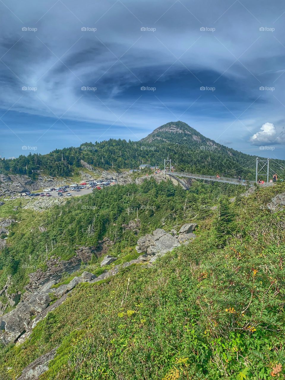 A swinging bridge a mile above sea level. The clouds forming around the mountain top are amazing. Grandfather Mountain in North Carolina. 
